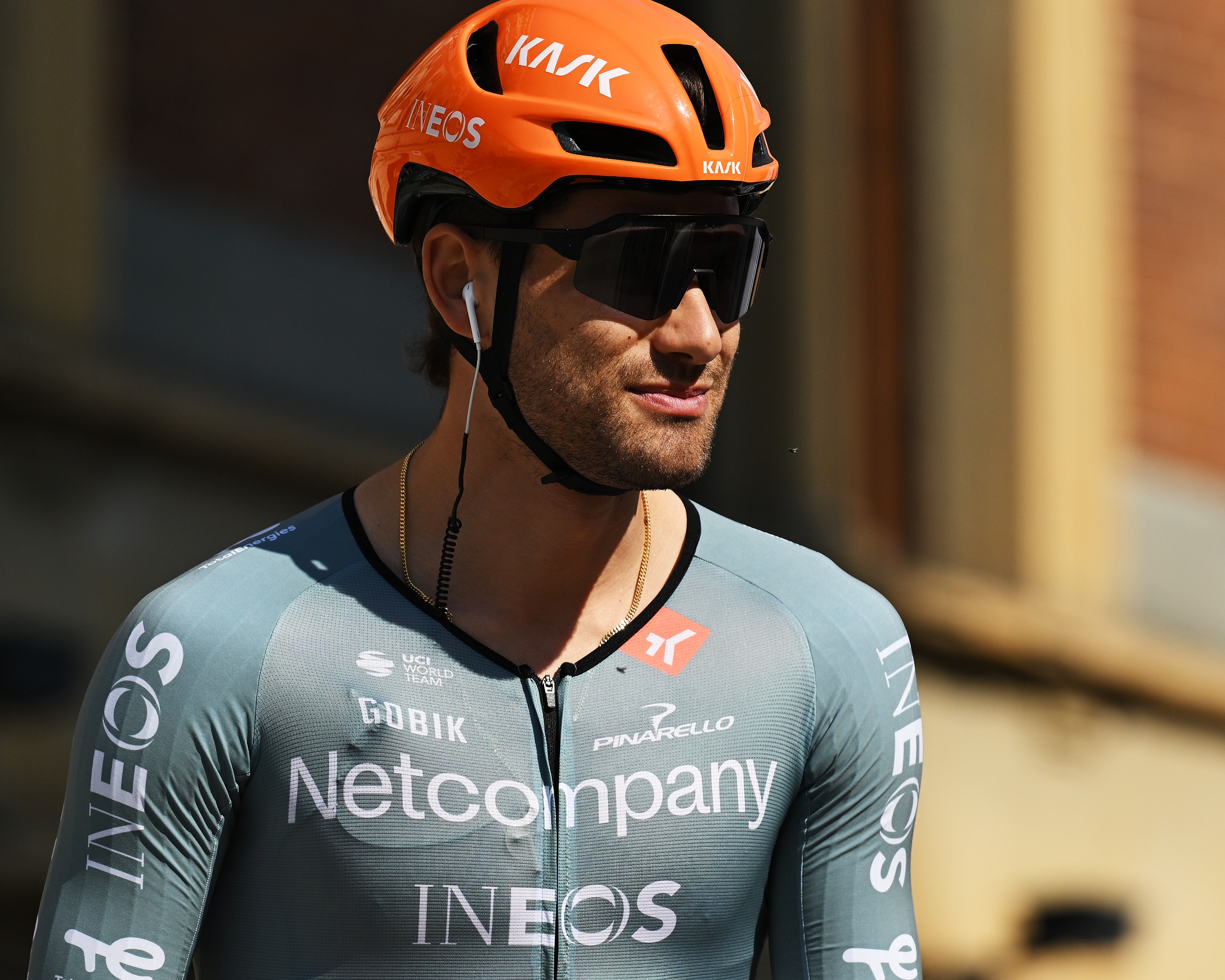 Filippo Ganna wearing an orange Kask helmet in Netcompany Ineos colours