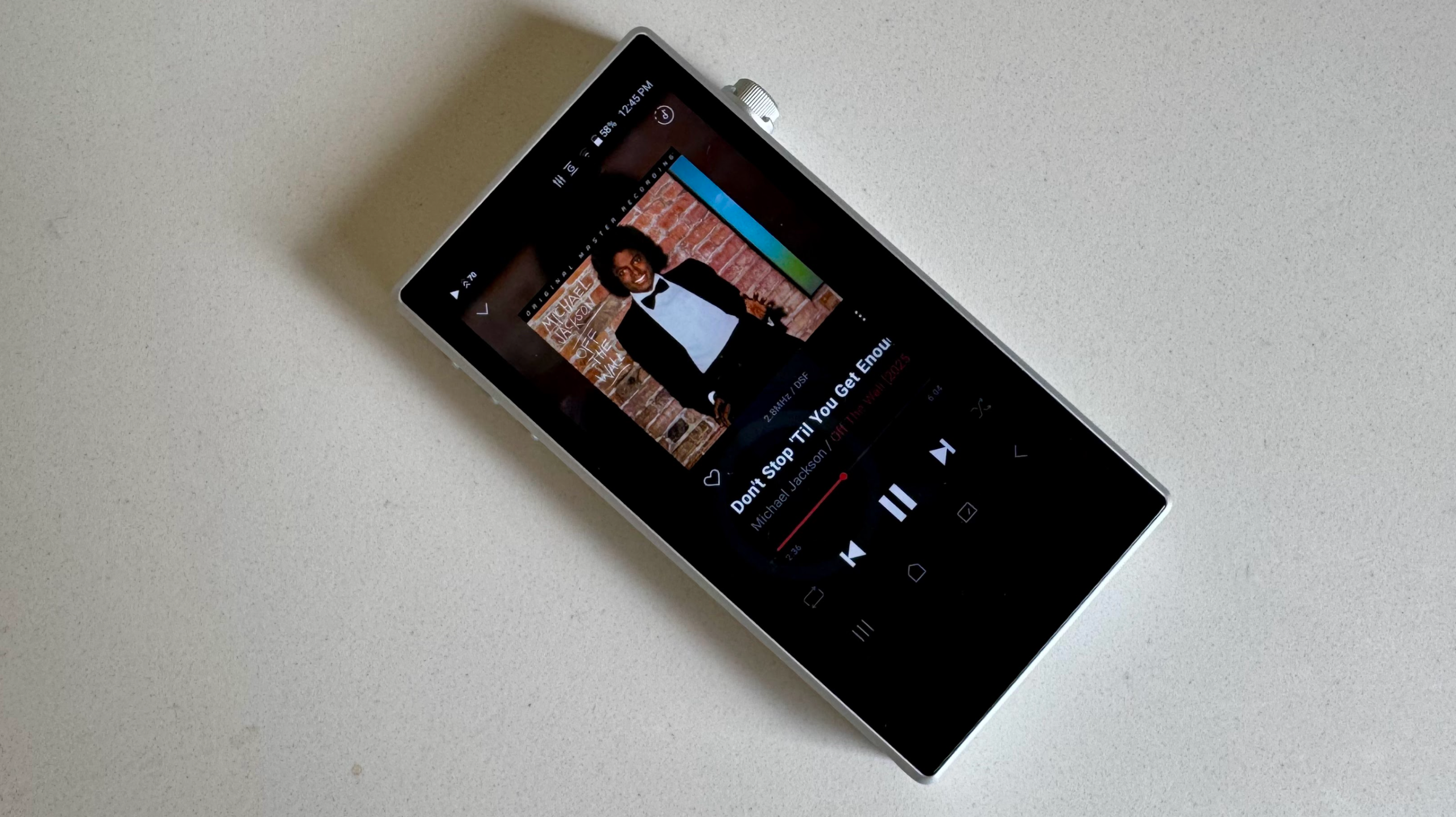 Astell &amp; Kern's PD5 player on a gray table, showing details of the player 
