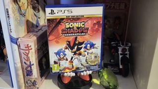 Image of a PS5 copy of Sonic X Shadow Generations sitting amongst a shelf of SEGA related merch.