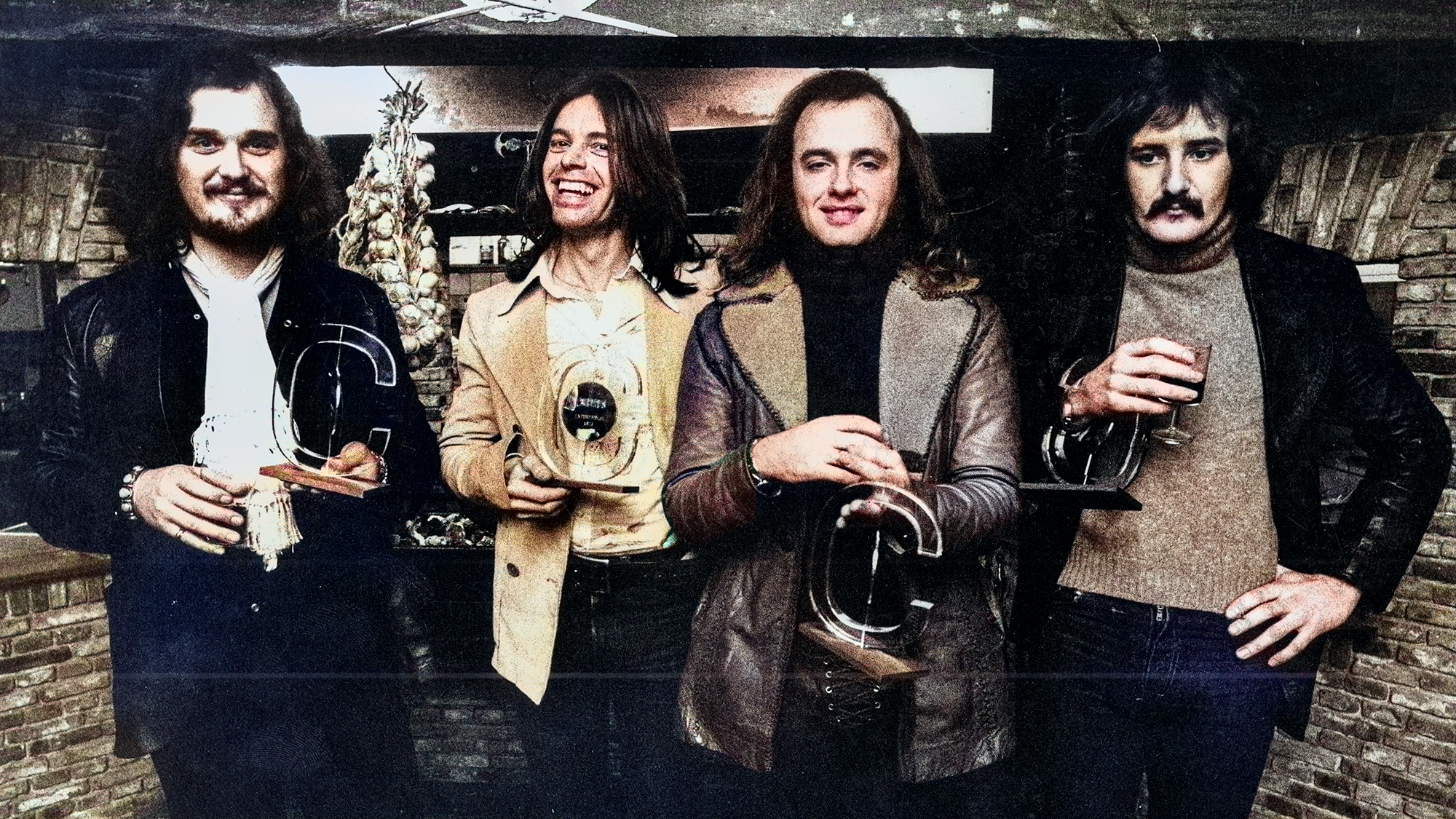 Dutch band Focus posed holding awards in Hilversum, Netherlands in 1975. Left to right: Bert Ruiter, Colin Allen, Thijs van Leer and Jan Akkerman. 