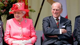 Queen Elizabeth II and Prince Philip, Duke of Edinburgh watch the Shropshire Diamond Jubilee Pageant