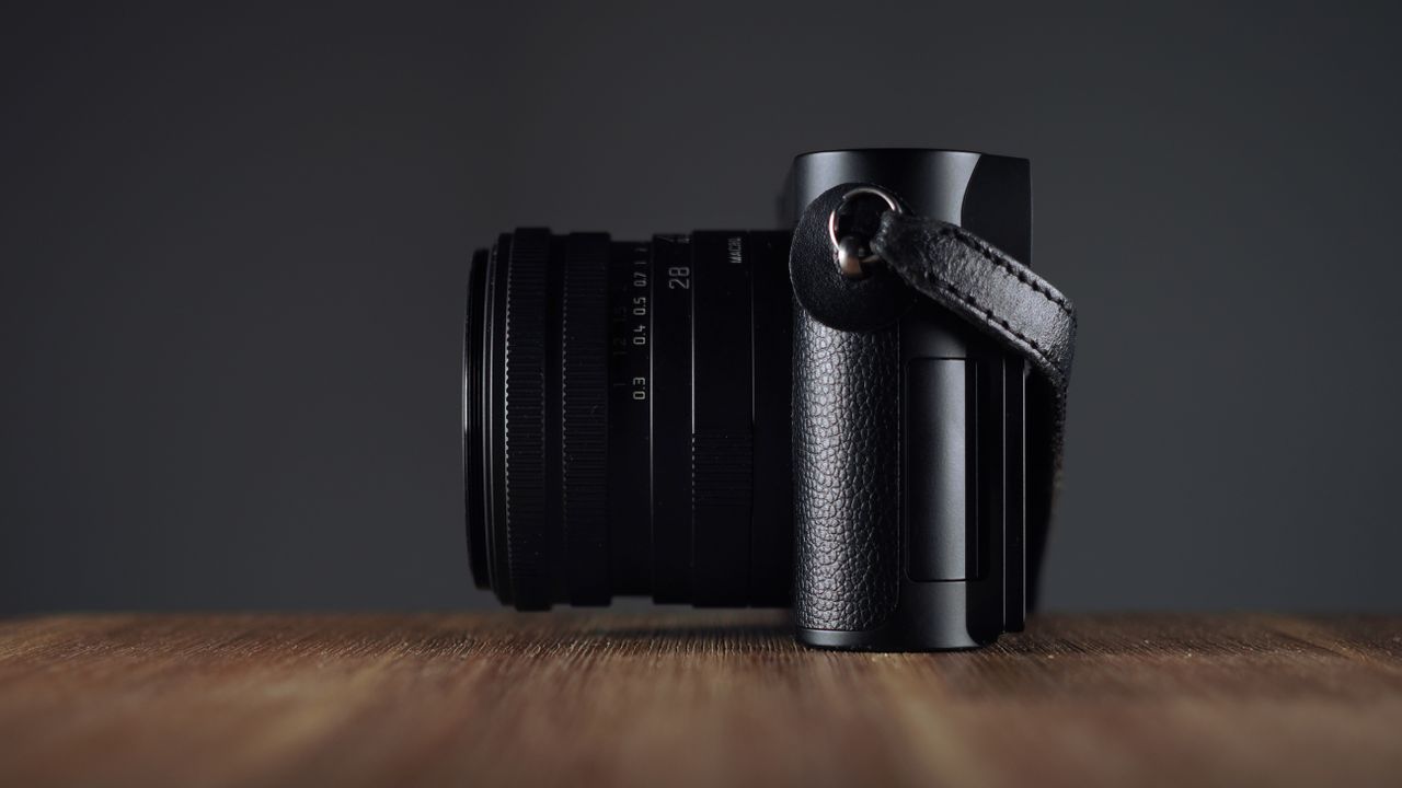 Leica Q3 Monochrom on a wooden surface