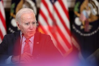 White House: A shot of President Biden speaking with the US flag in the background, and red light fringing around the image