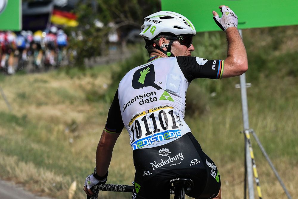 Mark Cavendish signals for support near the end of stage 11 at the Tour de France