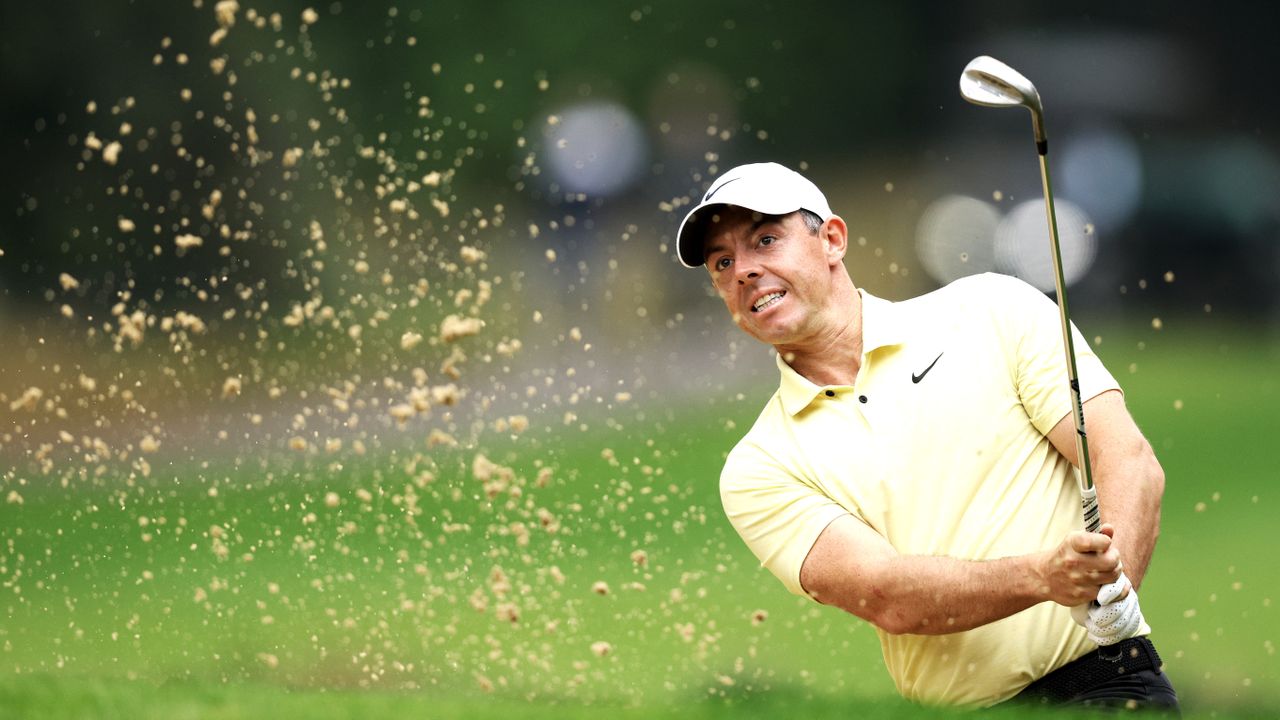 Rory McIlroy playing from a bunker