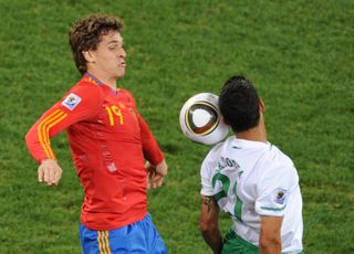 Spain's Fernando Llorente (left) competes for the ball with Portugal's Ricardo Costa at the 2010 World Cup.