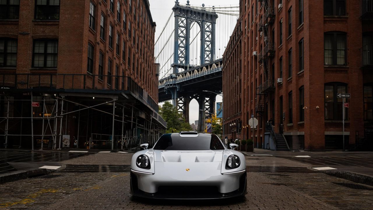 Front view of the Porsche Mission S, with the Brooklyn Bridge behind