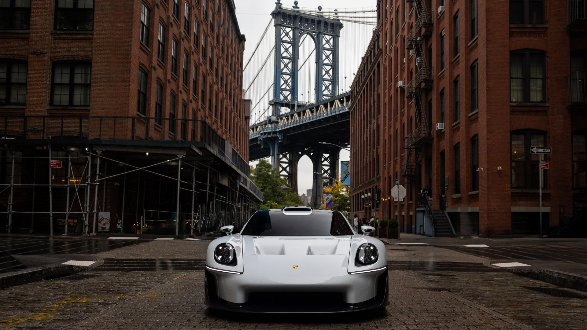 Front view of the Porsche Mission S, with the Brooklyn Bridge behind