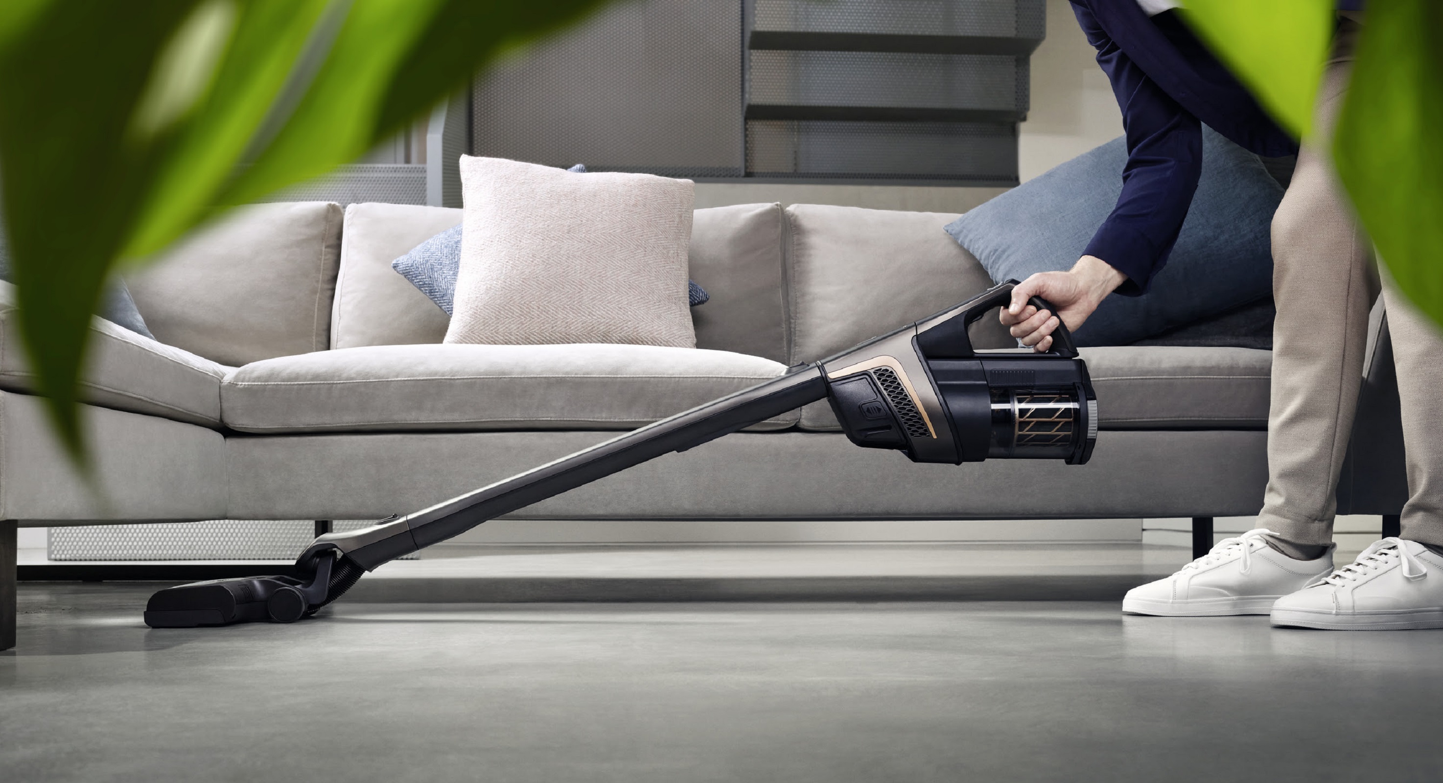 miele hx2 vacuuming under the sofa