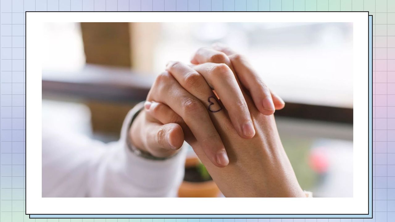 two people with small hand tattoos holding hands in front of a window, against a purple/blue background