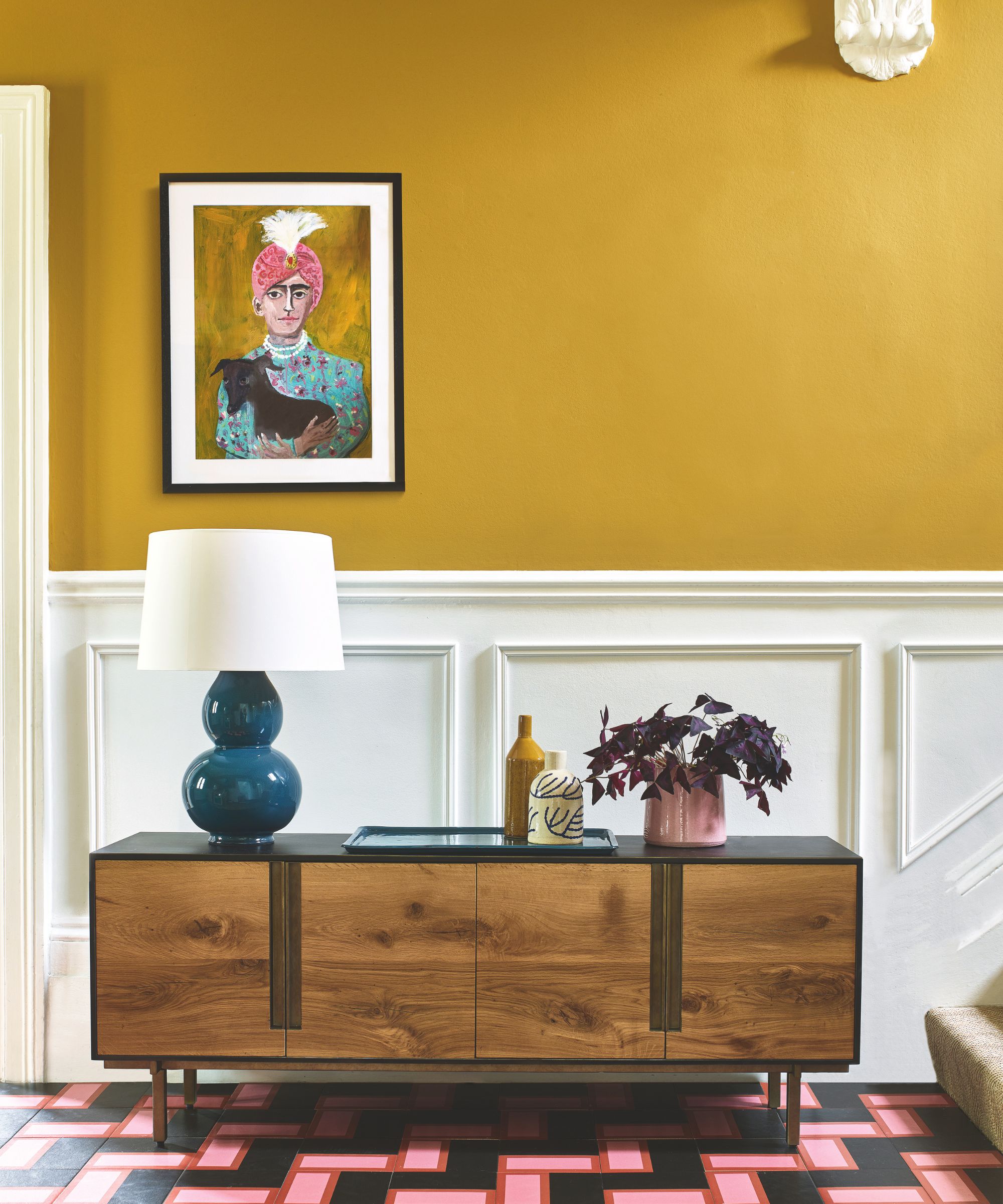 hallway with yellow wall and sideboard