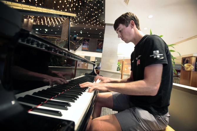 Chad Haga tickles the ivory at the race hotel.
