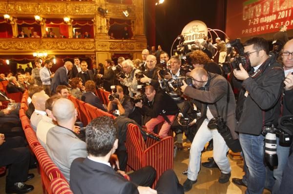 Riders face the cameras before the route is announced