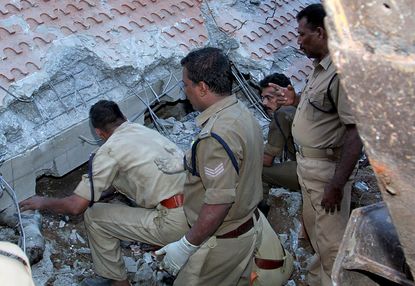 Rescue teams search for survivors after a Hindu temple explosion in Kollam, India