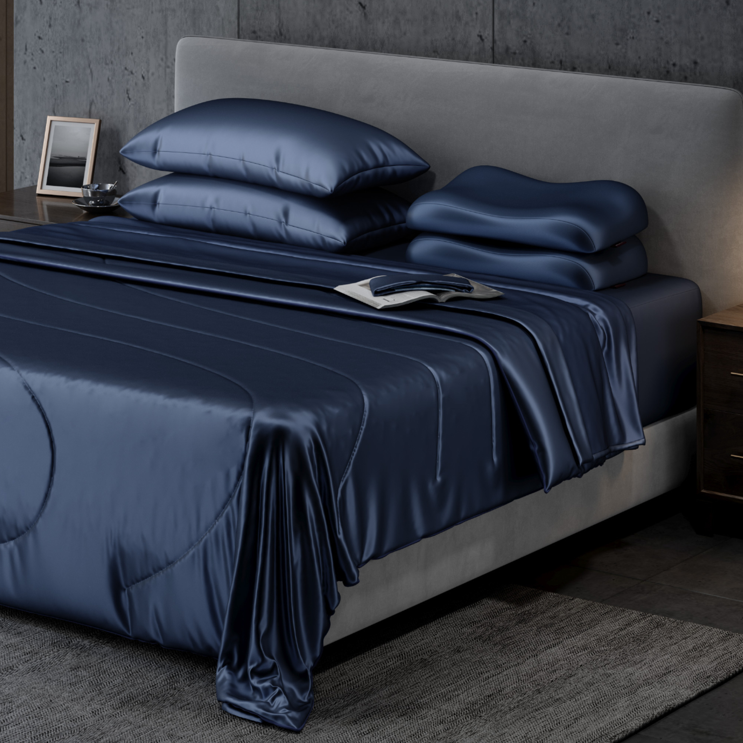 A bed with blure pillows and comforter