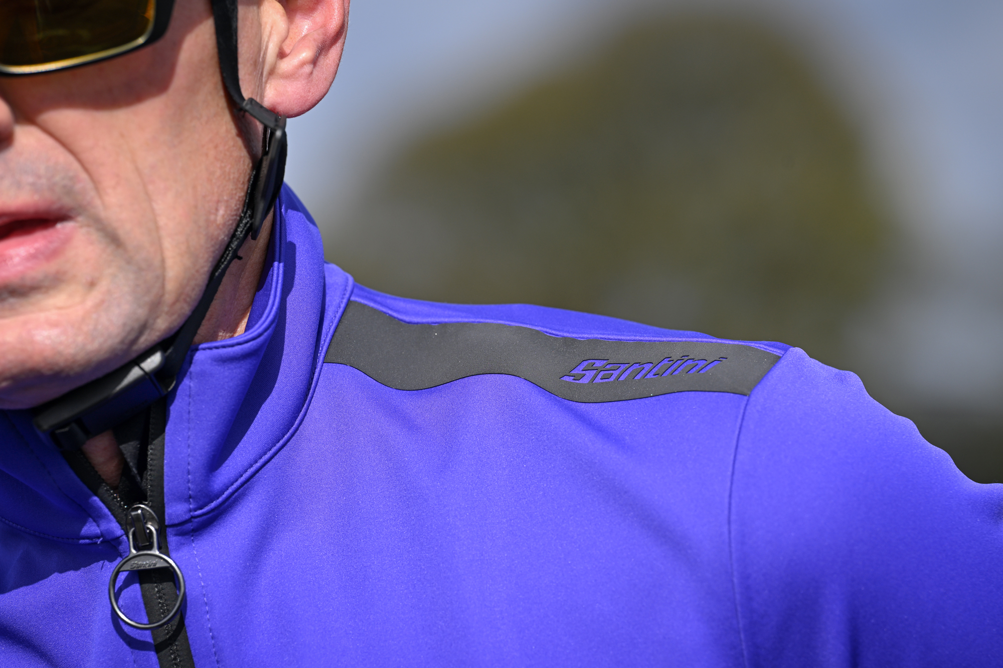 Close up of the Santini branding on the shoulder of a purple jacket