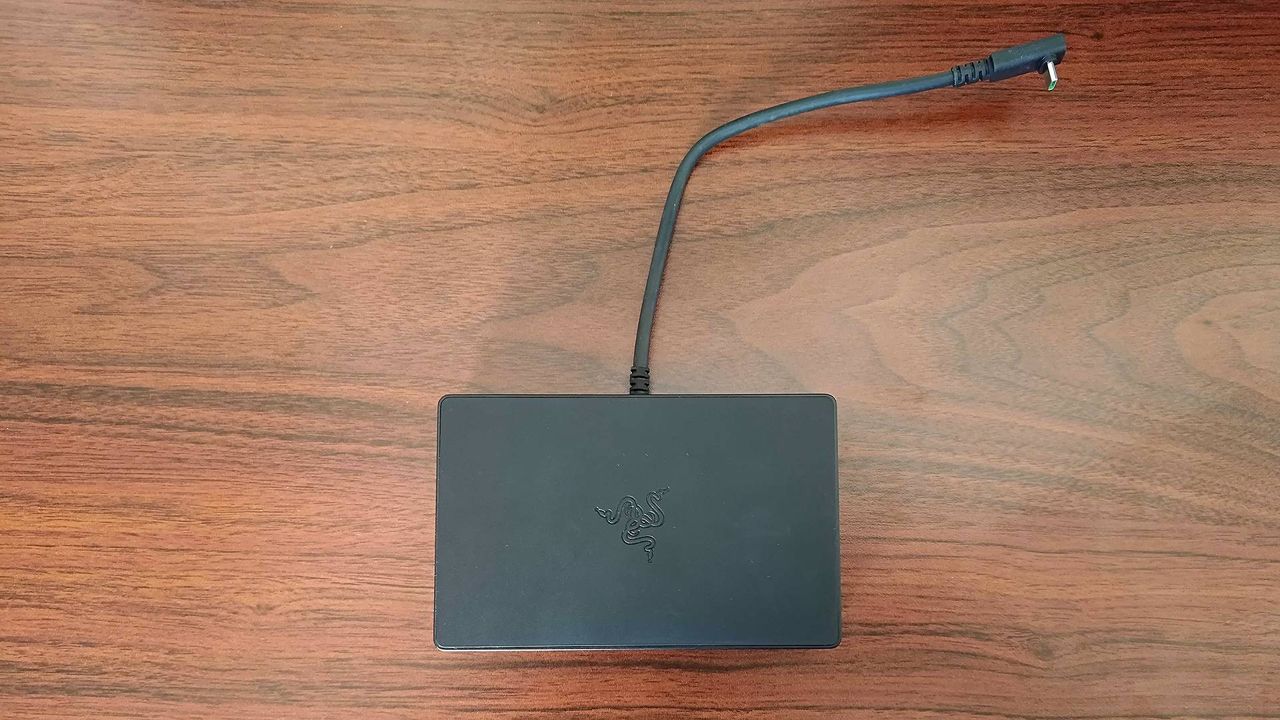 Top down view of Razer Handheld Dock sitting on woodgrain desk.