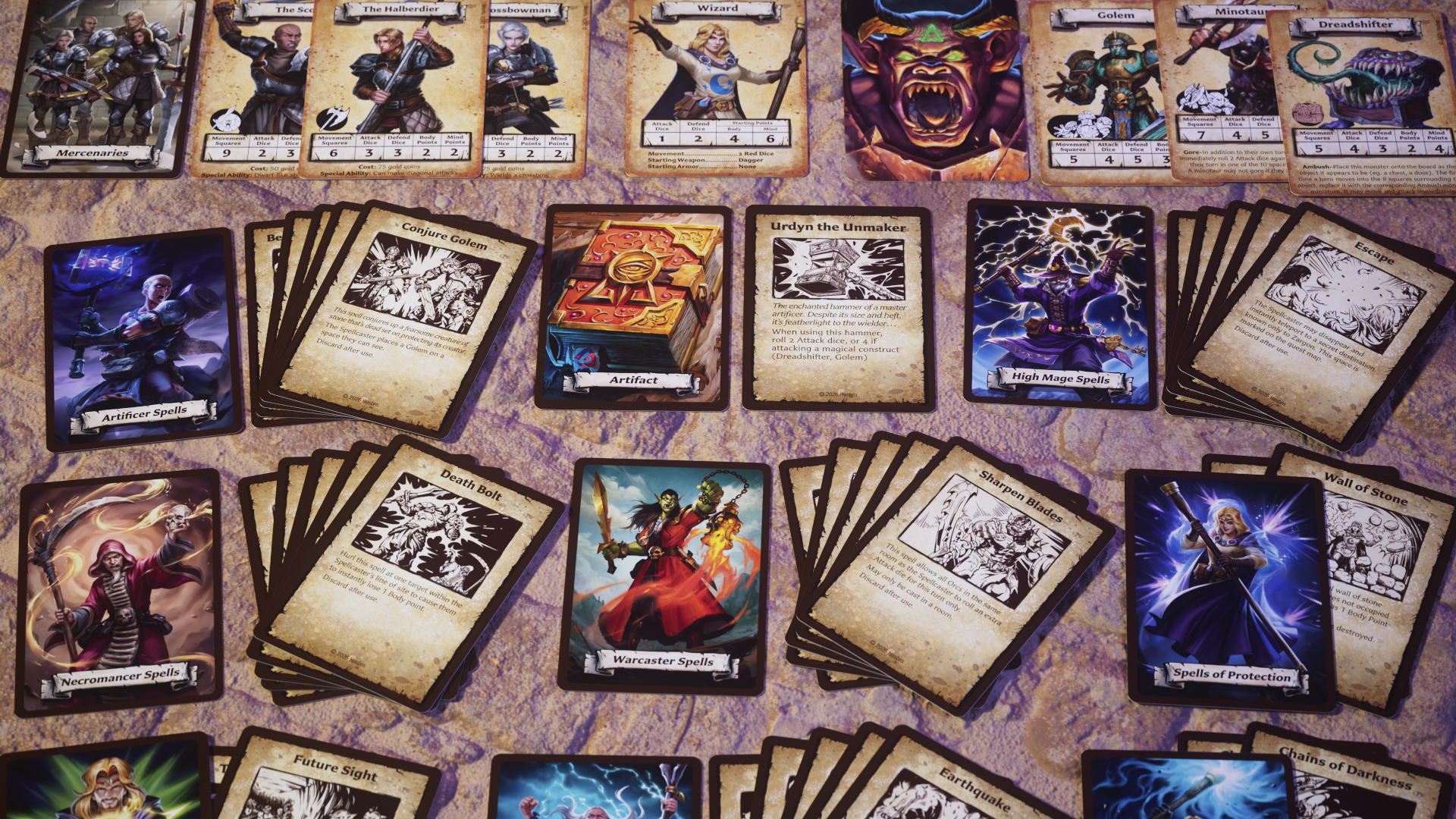 HeroQuest cards laid out on a stone surface