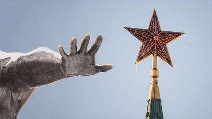 Russia statue hand red star