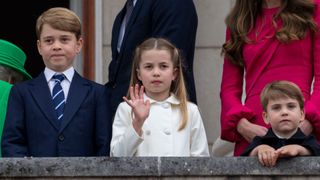 Prince George of Cambridge with Prince Louis of Cambridge and Princess Charlotte of Cambridge stand on the balcony at Buckingham Palace at the end of the Platinum Pageant on The Mall on June 5, 2022 in London, England