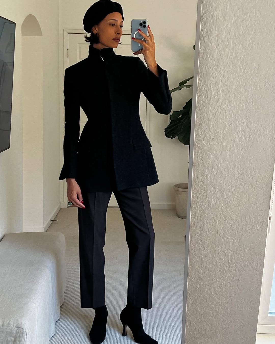Tylynn Nguyen wearing a Loro Piana blazer with the collar upturned