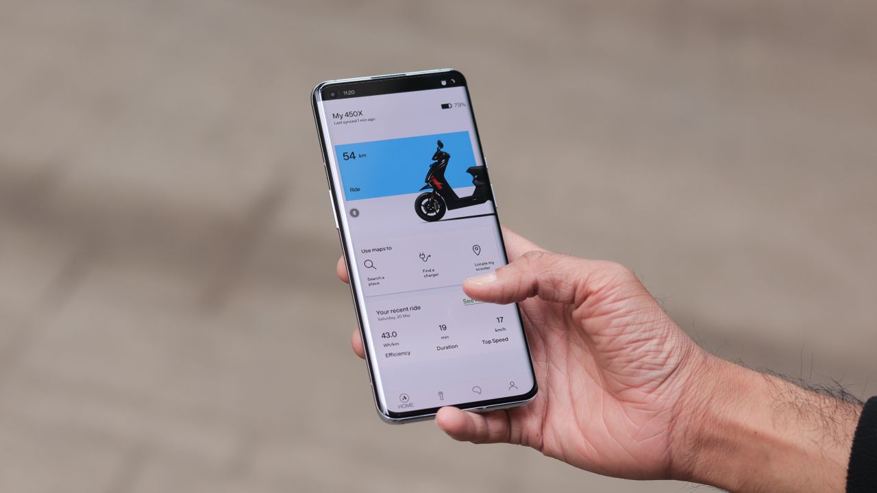 A OnePlus 9 Pro from the front, in someone's hand