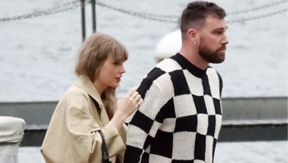 Taylor Swift and Travis Kelce in Lake Como where Taylor Swift wears a trench coat and carries a black Versace bag to match her black dress