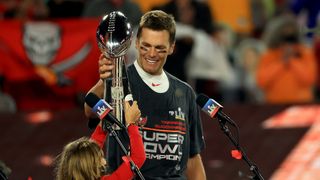 Tom Brady #12 of the Tampa Bay Buccaneers hoists the Vince Lombardi Trophy after winning Super Bowl LV at Raymond James Stadium on February 07, 2021 in Tampa, Florida. The Buccaneers defeated the Chiefs 31-9.