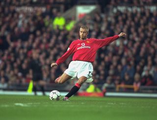 Manchester United's David Beckham hits a free-kick against Tottenham in 2000.