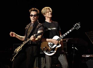 Earl Slick and David Bowie onstage