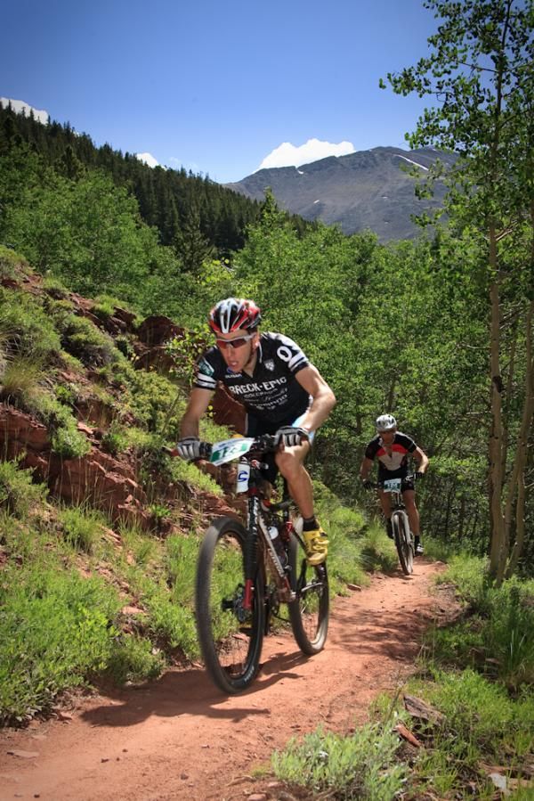 Race leader Jeremiah Bishop charges up a climb with Travis Brown hot on his heels.