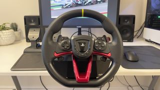 The Hori Racing Wheel Apex set up at a clean white desk.