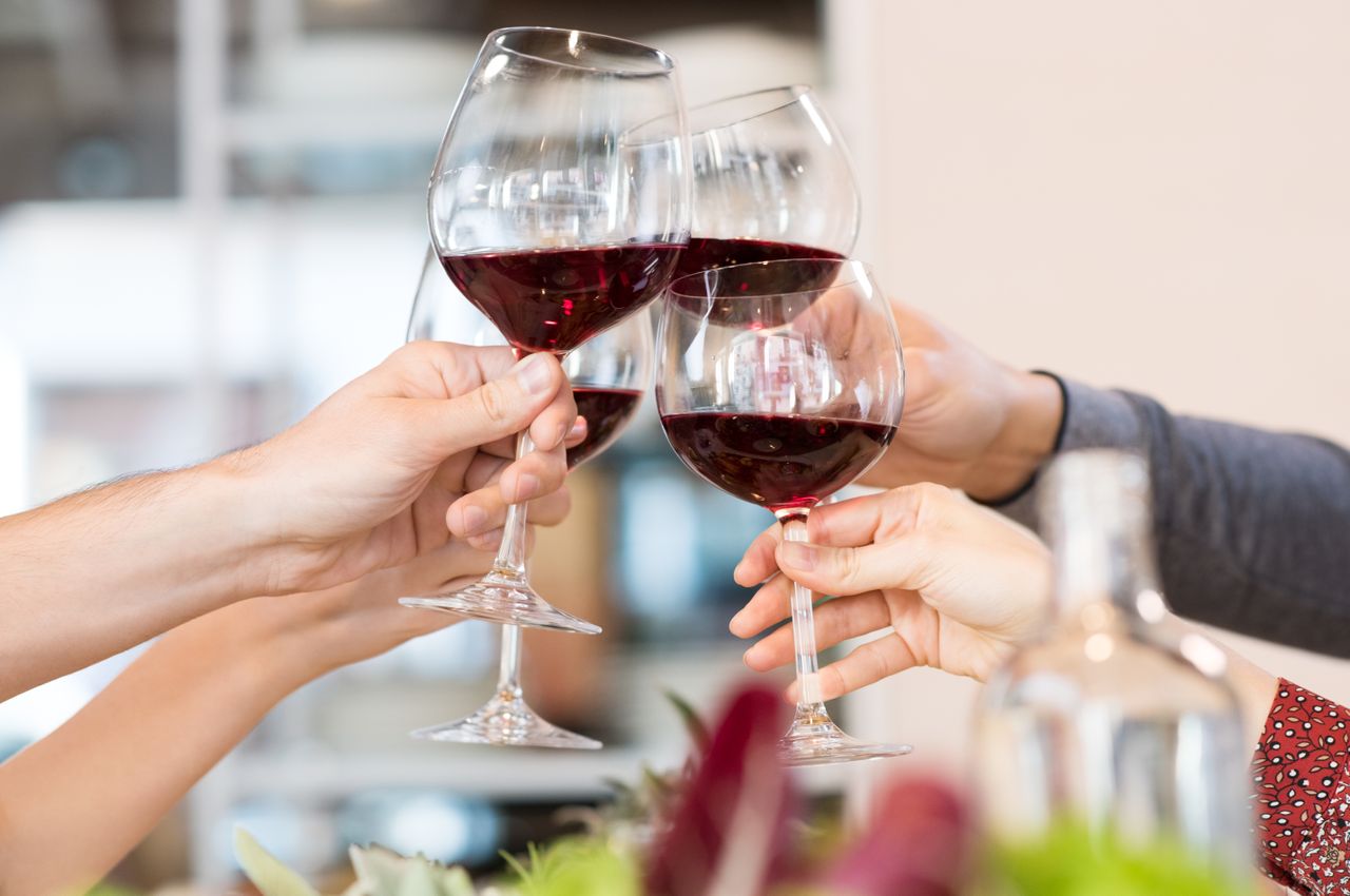 Toasting with wine glasses.