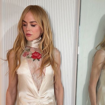Nicole Kidman wearing a gold dress with roses