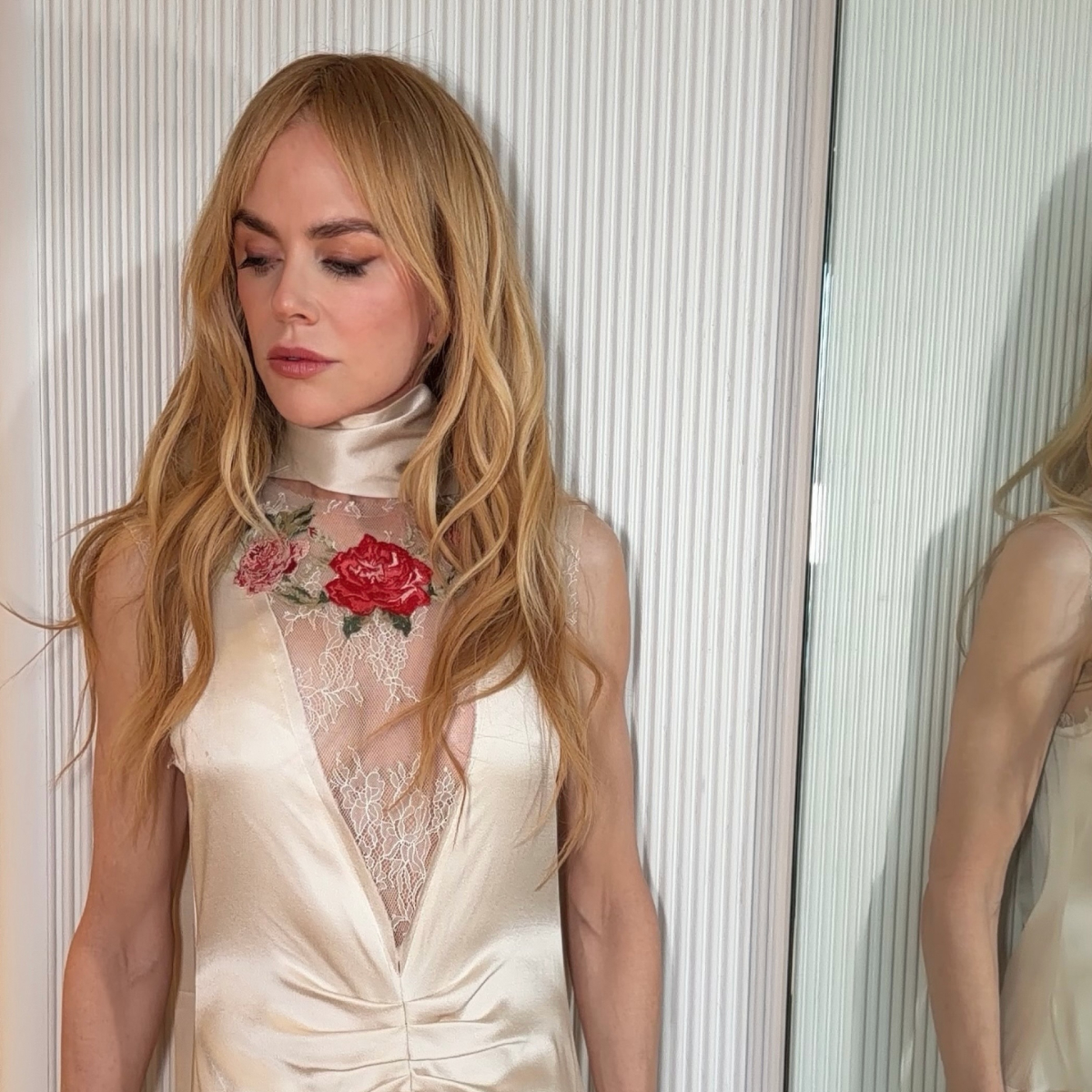 Nicole Kidman wearing a gold dress with roses