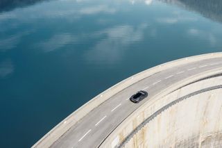 McLaren GT crossing dam, seen from above
