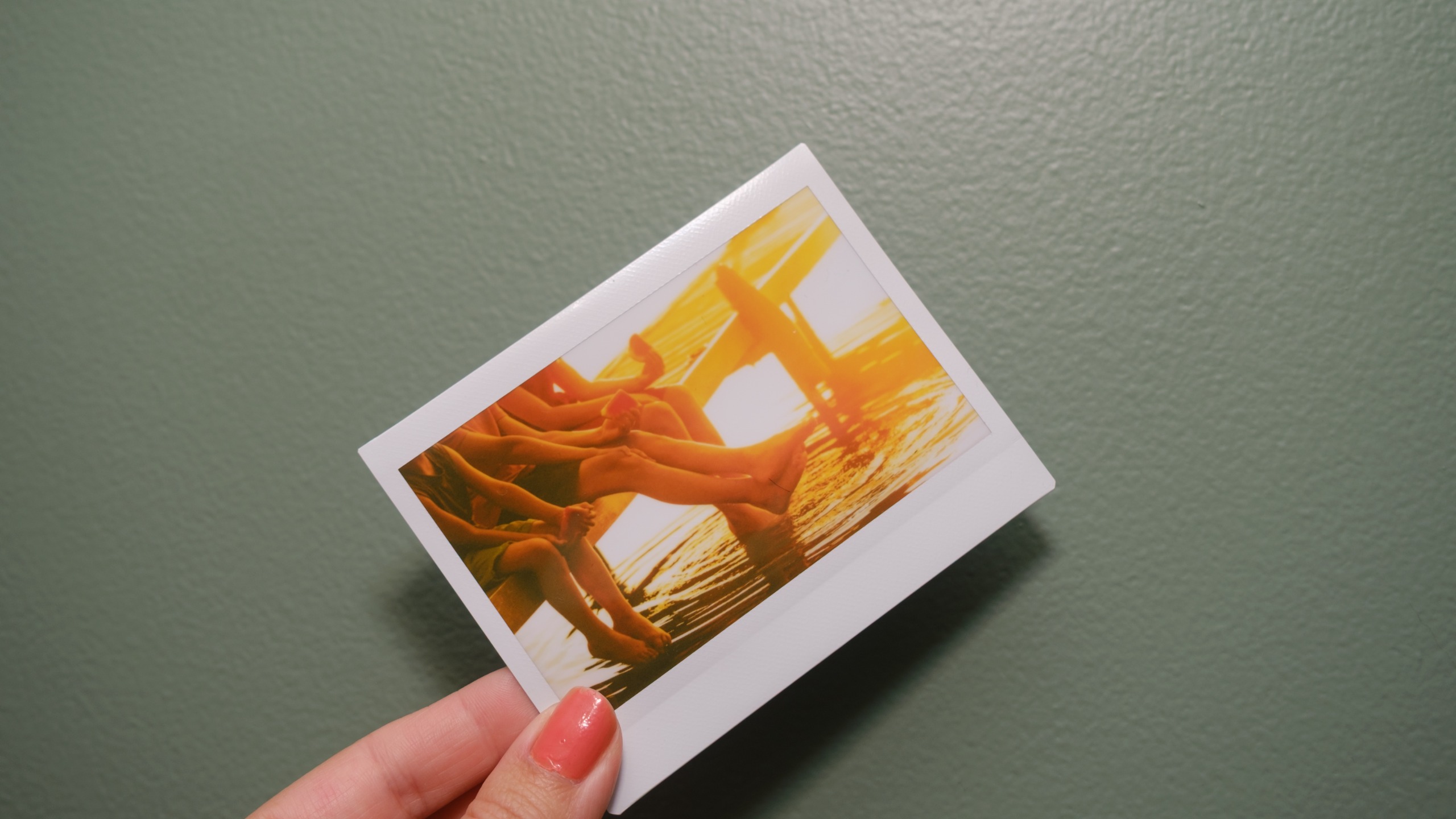 The Fujifilm Instax Link Wide 2 photo printer on a bookshelf