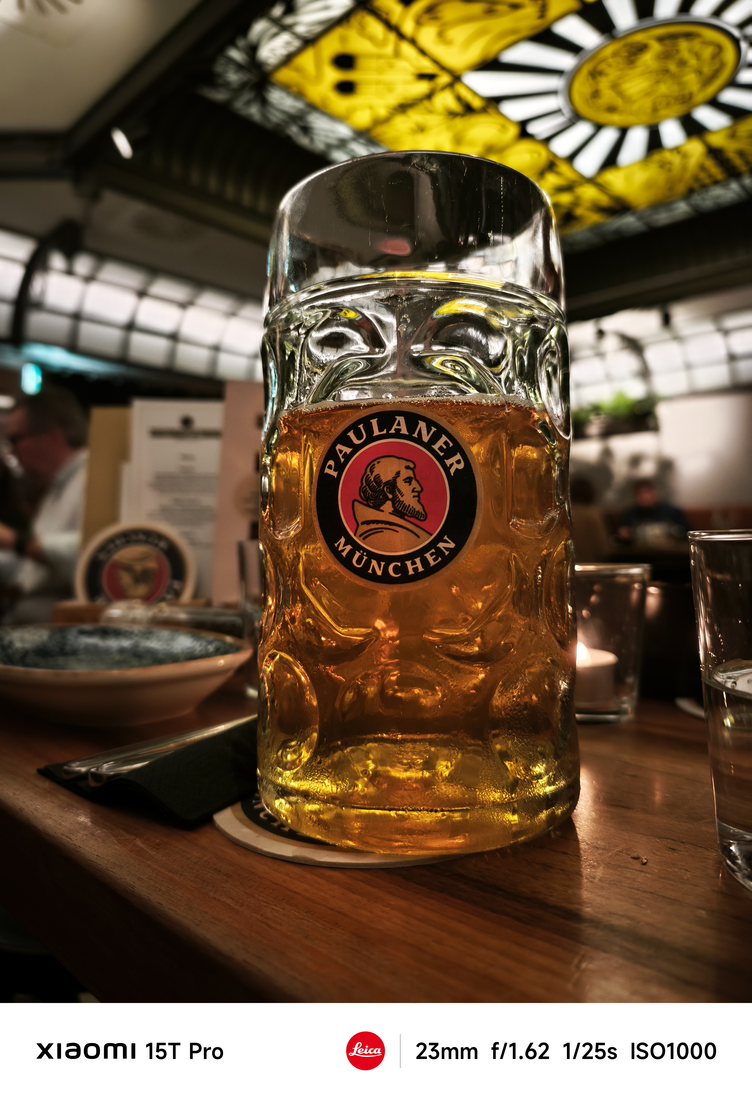 A half drunk beer in a pub