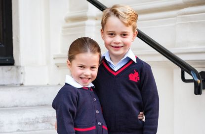 Prince George and sister Princess Charlotte in school uniform, posing outside Thomas's School Battersea.