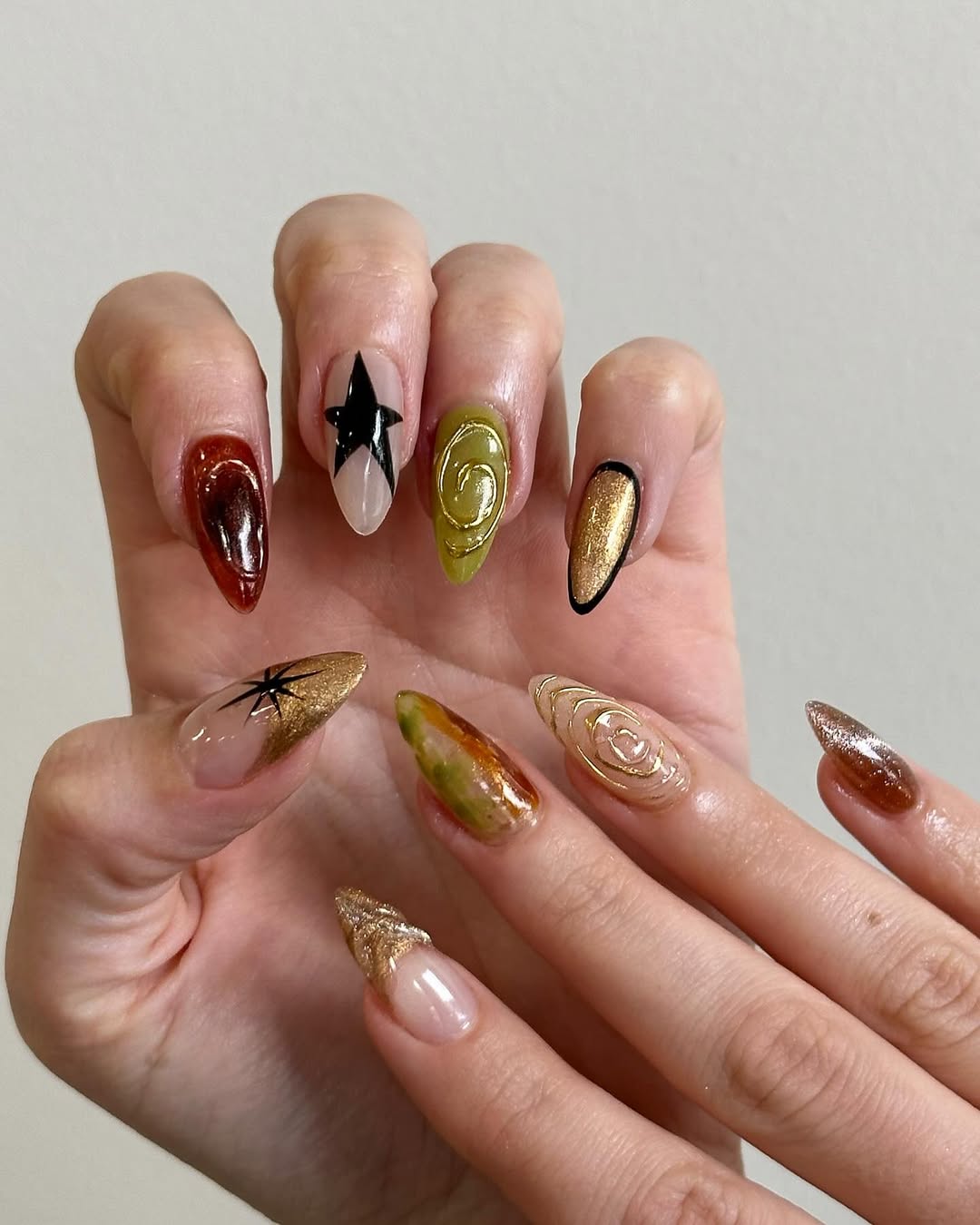 A mixed metal manicure with 3D nail art by Queenie Nguyen