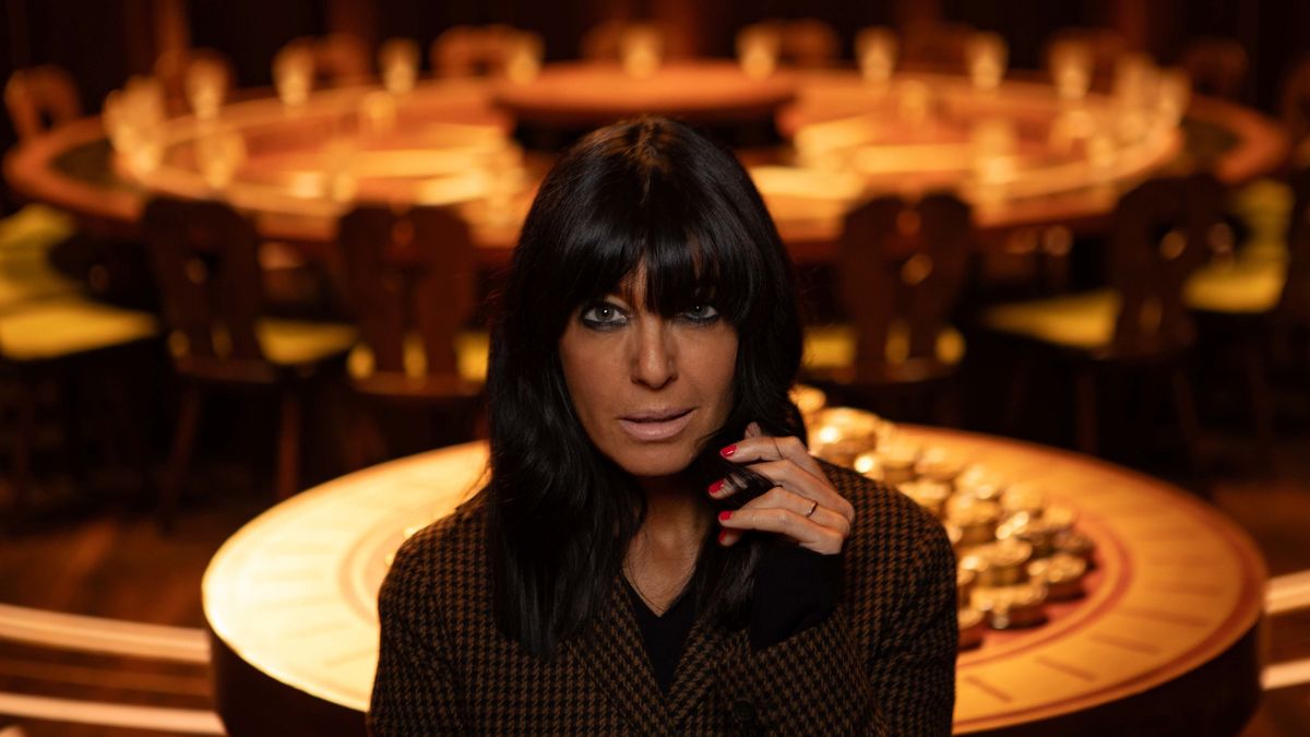 Claudia Winkleman poses in front of the Round Table for The Traitors season 2