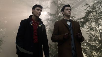 Jayden Revri as Charles Rowland and George Rexstrew as Edwin Payne, standing in a foggy forest, in episode 2 of DEAD BOY DETECTIVES