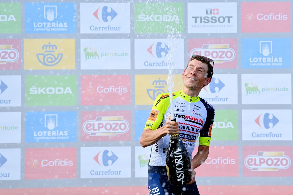LES PRAERESNAVA SPAIN AUGUST 28 Louis Meintjes of South Africa and Team Intermarch Wanty Gobert Matriaux celebrates at podium as stage winner during the 77th Tour of Spain 2022 Stage 9 a 1714km stage from Villaviciosa to Les Praeres Nava 743m LaVuelta22 WorldTour on August 28 2022 in Les Praeres Nava Spain Photo by Justin SetterfieldGetty Images