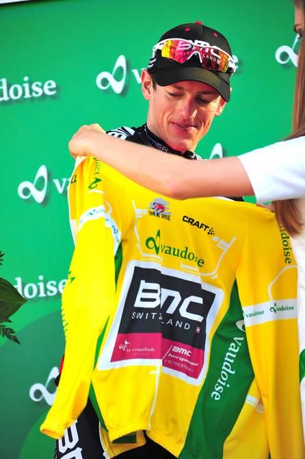 Mathias Frank slips on the yellow jersey