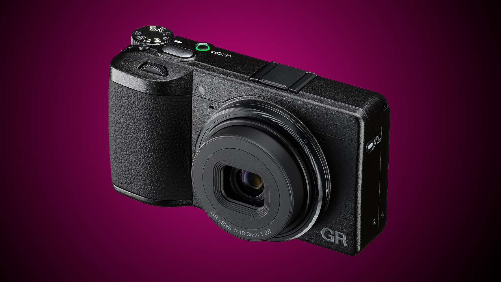 A Ricoh compact camera against a gradated purple background