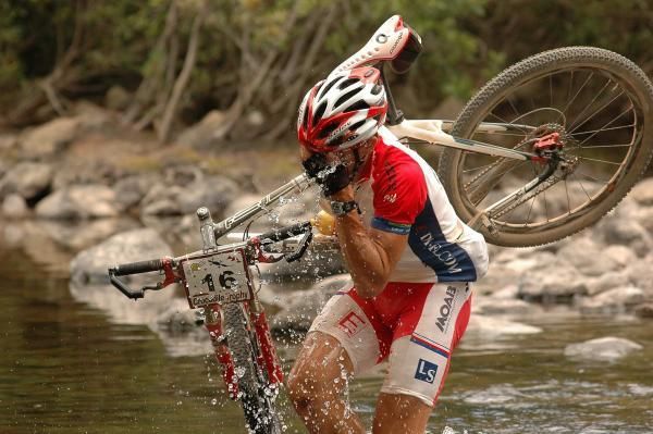 Czech Tomas Kozak cools down at the river crossing