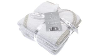 Image of white hooded towels wrapped in a bundle with a bow