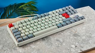 The Cherry K4 V2 on a stone surface with a blue background