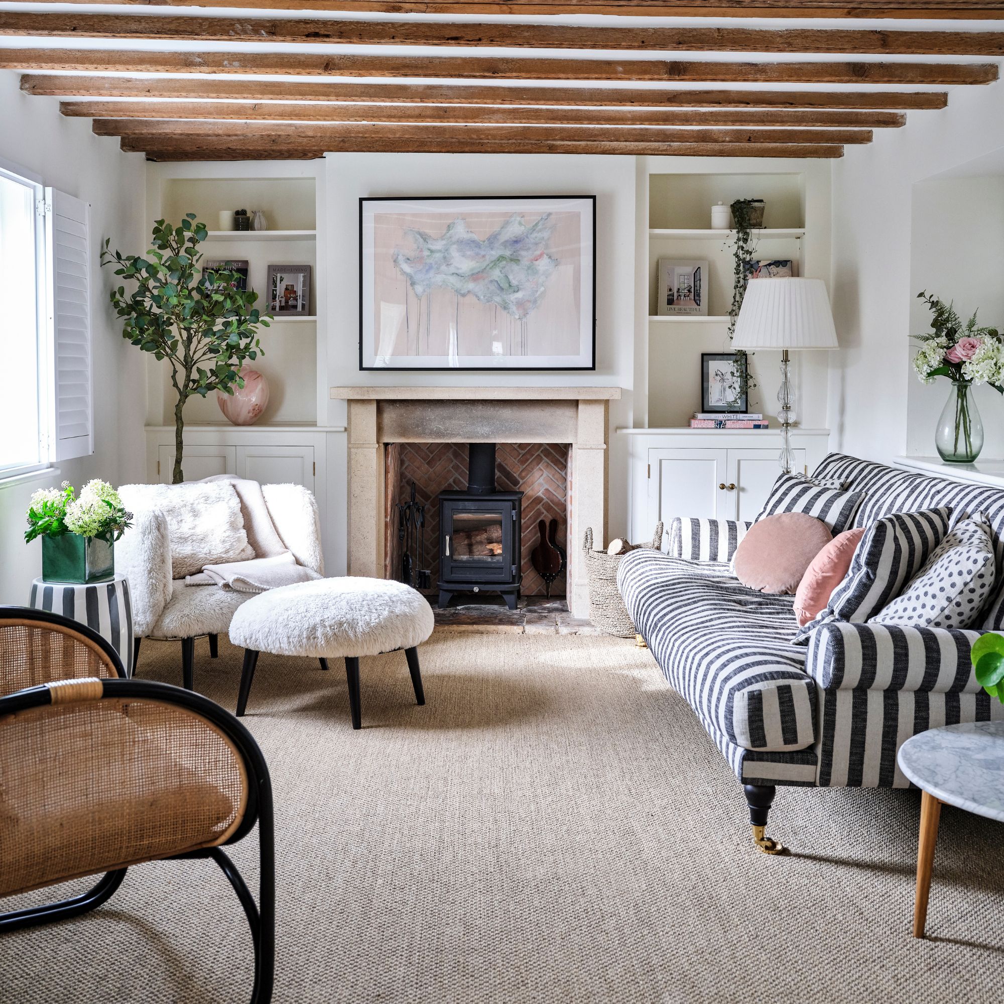 Period living room with carpet and a selection of striped sofas and accent chairs