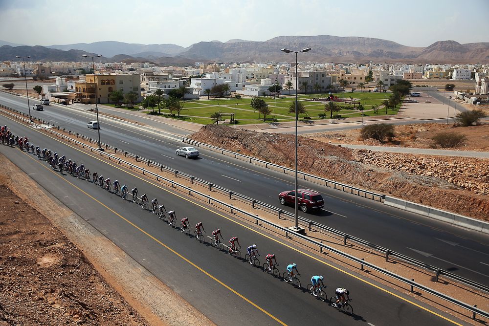 The peloton rides along the highway during stage one of the 2016 Tour of Oman